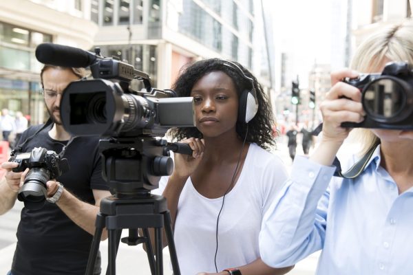 close-up-camera-crew-filming-interview